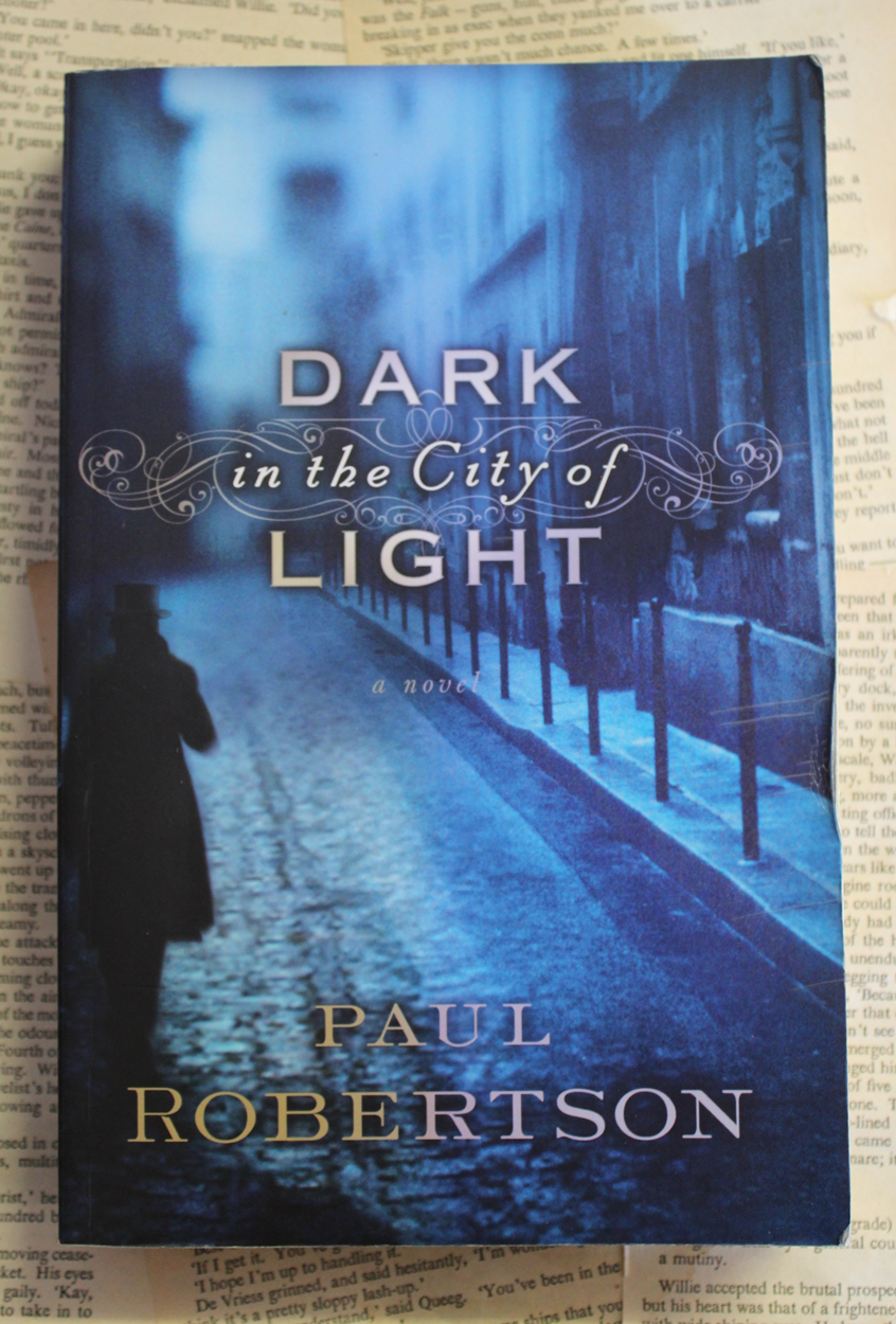 Dark in the city of light - Paul Robertson