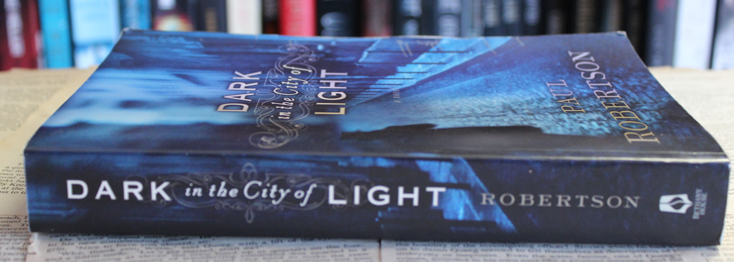 Dark in the city of light - Paul Robertson